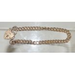 A hollow link, 9ct gold curb bracelet, with padlock clasp. 9.8g approx.