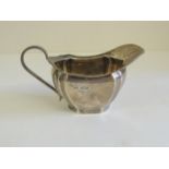 A silver cream jug, hallmarked for Sheffield 1928 and by "VINERS", gilt interior. 5.7oz approx.