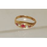 A ladies 18ct gold ring, central panel of Navette shape set with two diamonds and three red