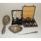 A cased set of six silver teaspoons, hallmarked for London 1941, a cased silver baby's spoon and