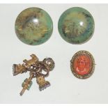 A pair of large, green, glazed "RUSKIN" buttons, small group of seals including a watch key set with