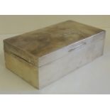 A plain silver, table cigarette box, hallmarked for Birmingham 1920 (small dents to side)