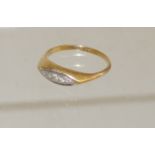 An 18ct gold, ladies diamond ring, set with five graduated diamonds within a central Navette