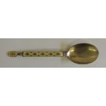 A Norwegian silver and enamelled spoon, by "J.TOSTRUP, NORWAY". The yellow enamelled handle with