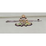 A gold (tested) enamelled and diamond set Royal Artillery Sweetheart brooch.