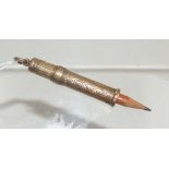 A 9ct gold propelling pencil, the barel foliate engraved. Maker's mark "A.D.LD".