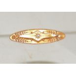 A Victorian 15 ct gold bar brooch, set with a central diamond and with etruscan style flower and