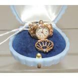 A ladies 18 k gold, watch dress ring. The dial marked "HEBE, 17 JEWELS", with decorative, hinged,