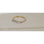 A ladies 18ct gold, five stone, graduated diamond ring, platinum claw set in openwork mount. Size R.