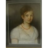 EARLY 19TH CENTURY ENGLISH SCHOOL - Portrait of a young woman, head and shoulders, wearing a coral