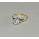 A 9ct gold, cubic zircon solitaire ring, the stone set in openwork cage mount. Ring size N.