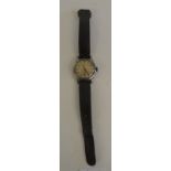 A gents military wristwatch, silvered dial, luminous hands, Arabic numerals, case marked with