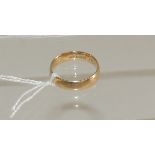An 18ct gold wedding band. Ring size R. 6g approx.