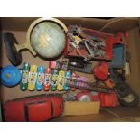 A quantity of assorted toys including a small Chad Valley globe; some Western sheriff's stars, spurs