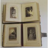 Two Victorian leather bound photograph albums containing contemporary studio portraits, some