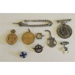 A brass On War Service badge 1915; a silver curb link watch chain; commemorative badges and other