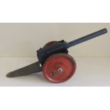 A tinplate field gun, blue with red wheels, with side operating lever firing the gun, 36cms long ++