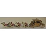 A painted diecast 1953 Coronation Coach with eight horses and four outriders, figure of Queen