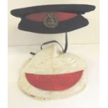 A Royal Marine Light Infantry Broderick cap with original brass badge, white cap cover and spare red