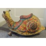 A painted metal ride-on snail approx 36cms high 71cms long ++rusted
