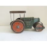 A c.1940's tinplate clockwork road roller, 14cms high ++general rusting