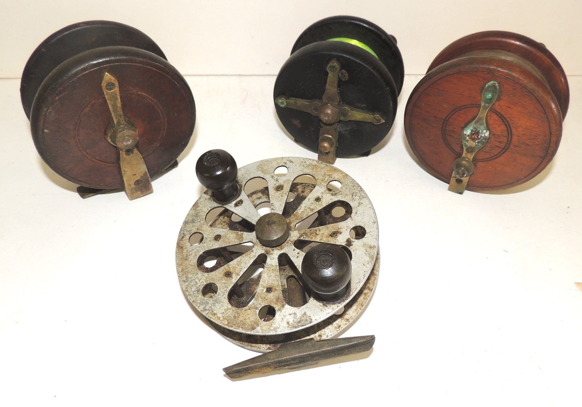 FISHING - a dark wood Nottingham style reel 3.75" with brass star back; two wood and brass reels and