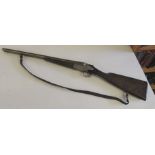 A toy shotgun, made in Spain "Beretta" with cast metal lock plate and original plaited leather