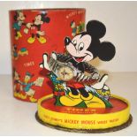 A TIMEX MICKEY MOUSE WRISTWATCH AND STAND the watch with Mickey Mouse on the dial having moving