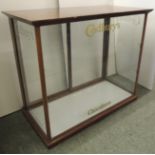 CADBURYS CHOCOLATES - a mahogany display cabinet, polished mahogany and with sliding glass rear