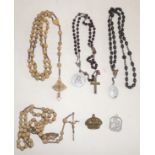 A late 19th Century rosary the cross fitted with a Stanhope of a saint together with three other