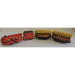 A Brimtoy tinplate clockwork train comprising streamlined loco "The Prince" and tender, BR and two