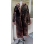 A brown faux fur ladies coat with brown silk lining ++good condition