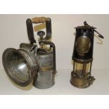 A miners lamp with brass plate for "The Protector Lamp and Light Co." and numbered "68" 23.5cms high