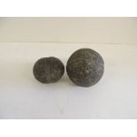 Two 19th Century metal cannon balls, each with central "seam", possibly American Civil War, 6.5cms