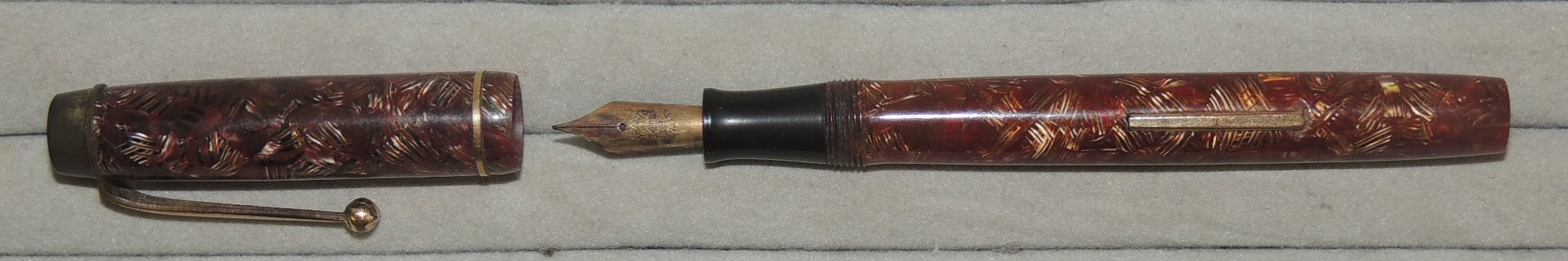 A Curzons Ltd "Summit" fountain pen on red/gold casing, side filler lever ++used but no damage