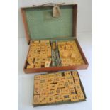 A quantity of early 20th Century Mah Jong tiles contained in original case