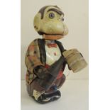 LINEMAR, JAPAN - a battery operated tinplate toy monkey holding bottle and mug and with glass