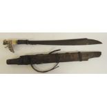 A late 19th Century Dyak Mandau with carved horn hilt, woven hair grip, blade of typical form with