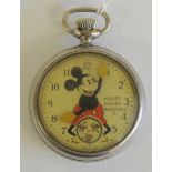 An Ingersoll Mickey Mouse pocket watch, the dial with image of Mickey with moving hands and with