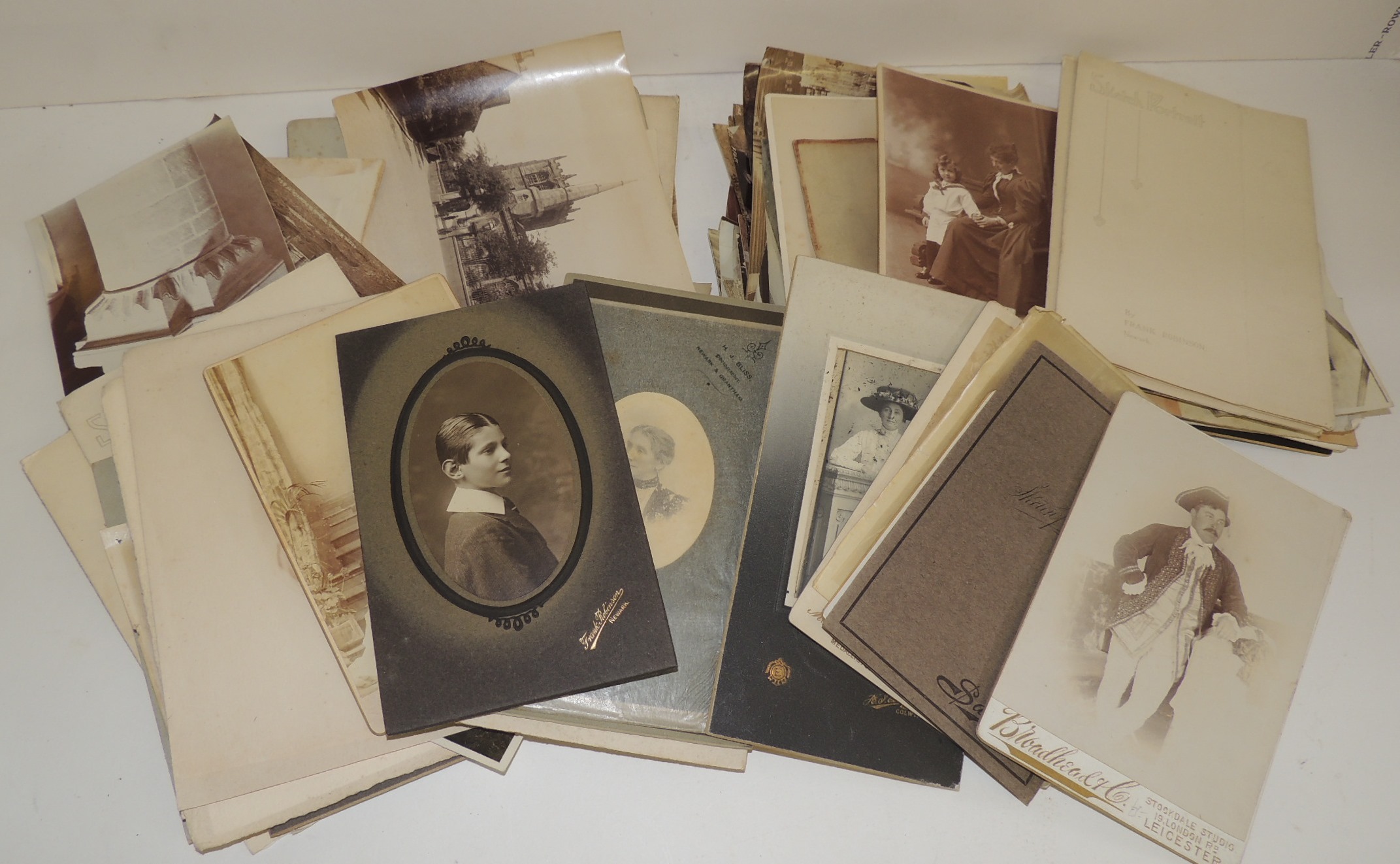 A quantity of assorted late 19th and later photographs including individual portraits, room