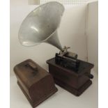 A Columbia Phonograph in oak case with domed cover and with side winding handle, original