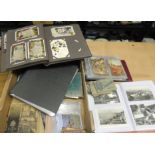 A quantity of assorted postcards contained in a variety of albums, includes churches, greetings,