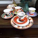 4 WEDGWOOD CLARICE CLIFF BIZARRE CUPS AND SAUCERS, SIDE PLATE, SUGAR CREAM