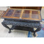 ORIENTAL CARVED HARDWOOD STAND WITH UNDERSHELF SHAPED SUPPORTS AND ONE DRAWER 52CM TALL