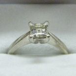 DIAMOND SOLITAIRE RING IN 4-CLAW PLATINUM SETTING, THE SQUARE-CUT DIAMOND OF APPROX 0.77 CARATS