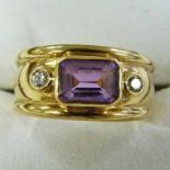 BAND RING SET WITH A STEP-CUT AMETHYST AND 2 DIAMONDS, THE SETTING MARKED 375