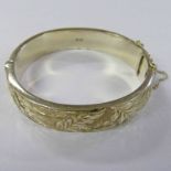 SILVER HINGED BANGLE WITH LEAF DECORATION MARKED BIRMINGHAM 1965