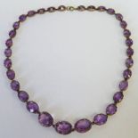 GRADUATED AMETHYST RIVIERE NECKLACE IN CLAW SETTING