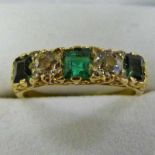EMERALD AND DIAMOND 5-STONE RING, THE 2 OLD-CUT DIAMONDS SET BETWEEN 3 SQUARE CUT EMERALDS IN A