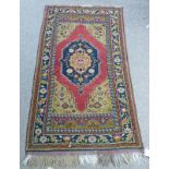 MIDDLE EASTERN RED, BLUE AND BROWN RUG 170 X 95CM